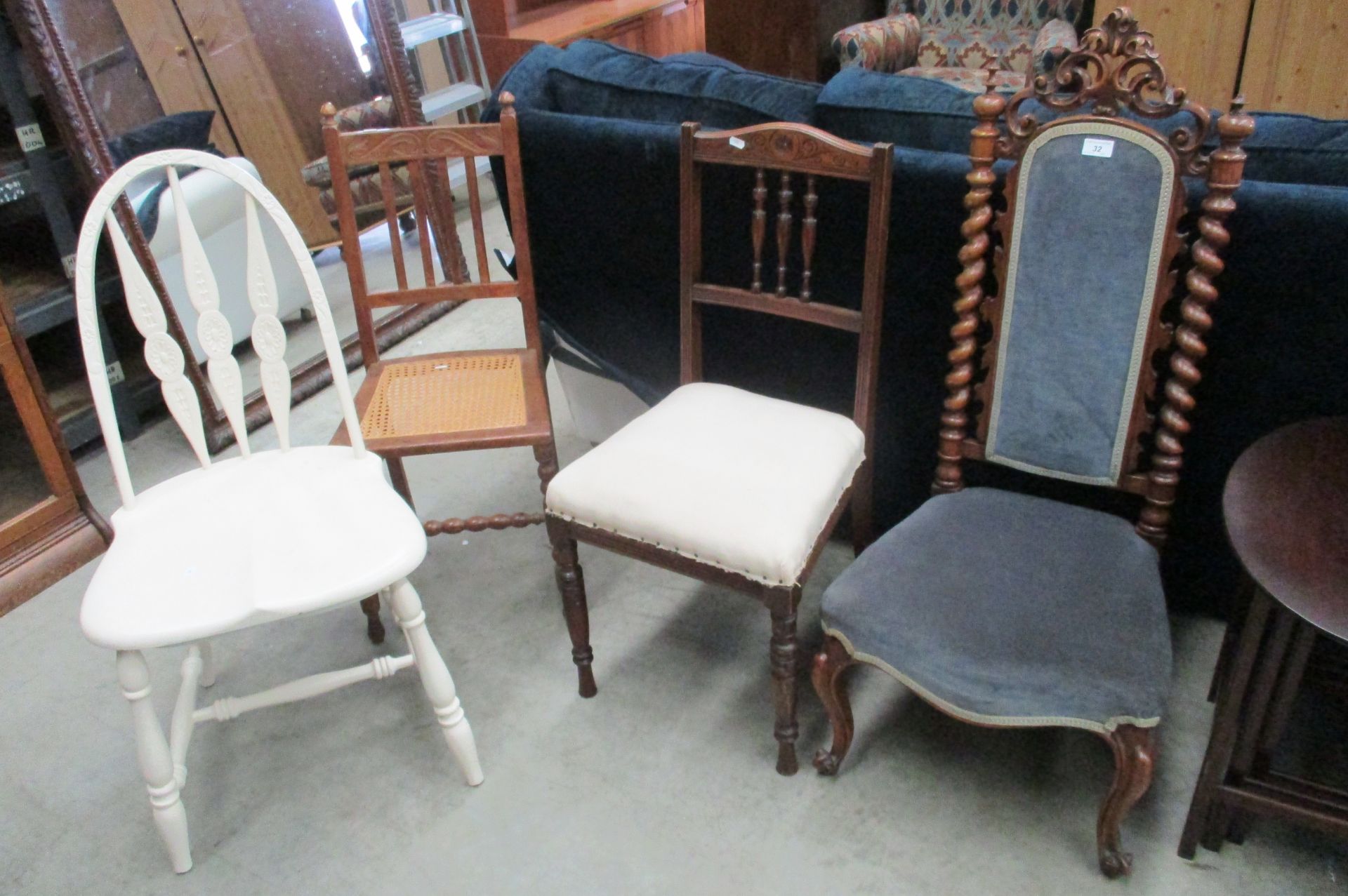 A Victorian carved oak mahogany side chair with a padded back and twist support on cariole legs and