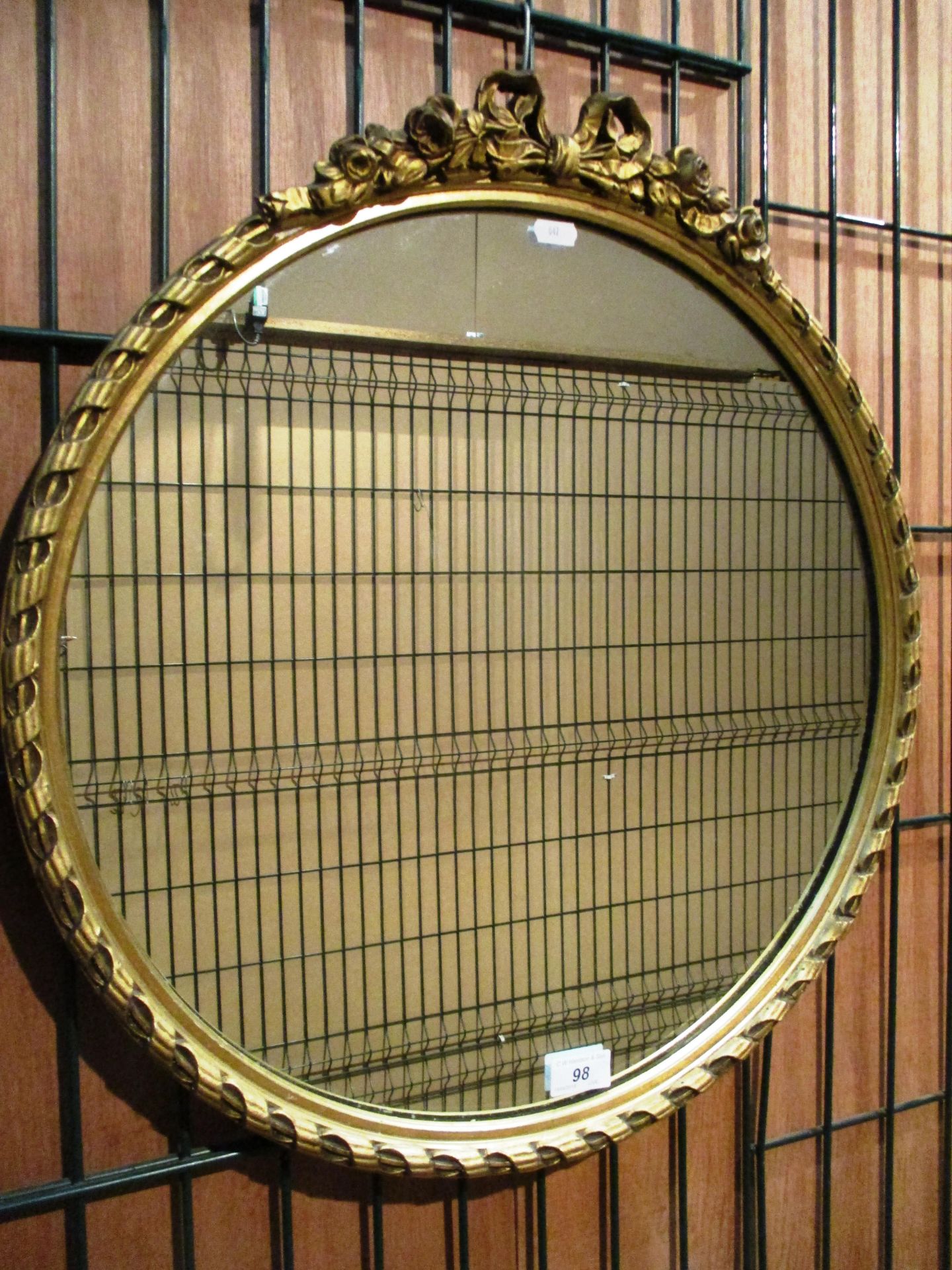 A gilt framed circular wall mirror