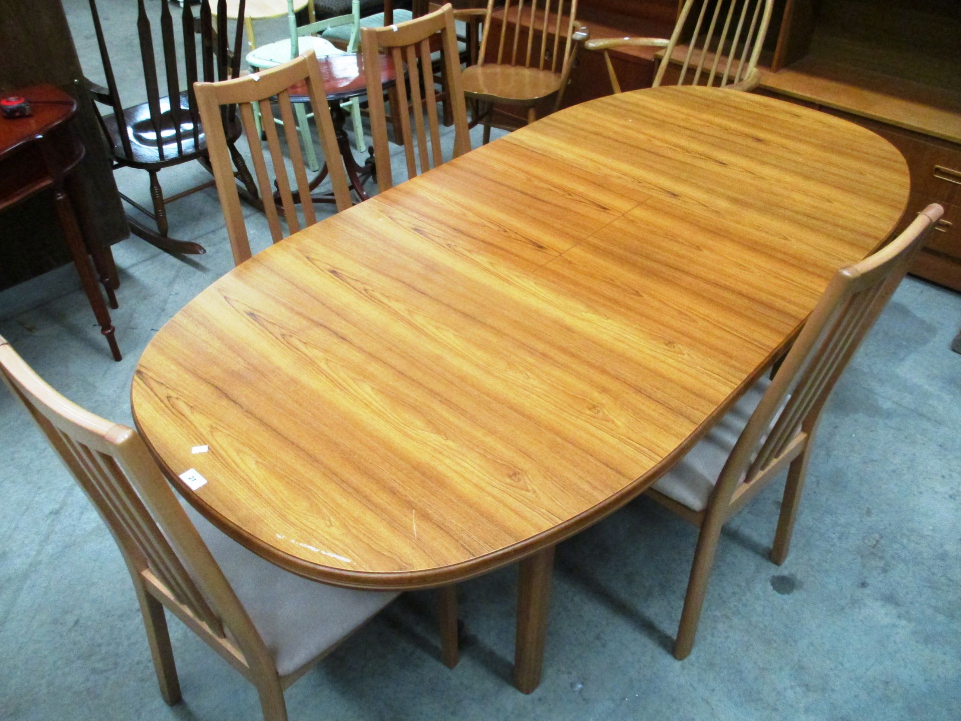 A Caxton oak veneered dining suite comprising 'D' ended extending dining table 92 x 195cm extended