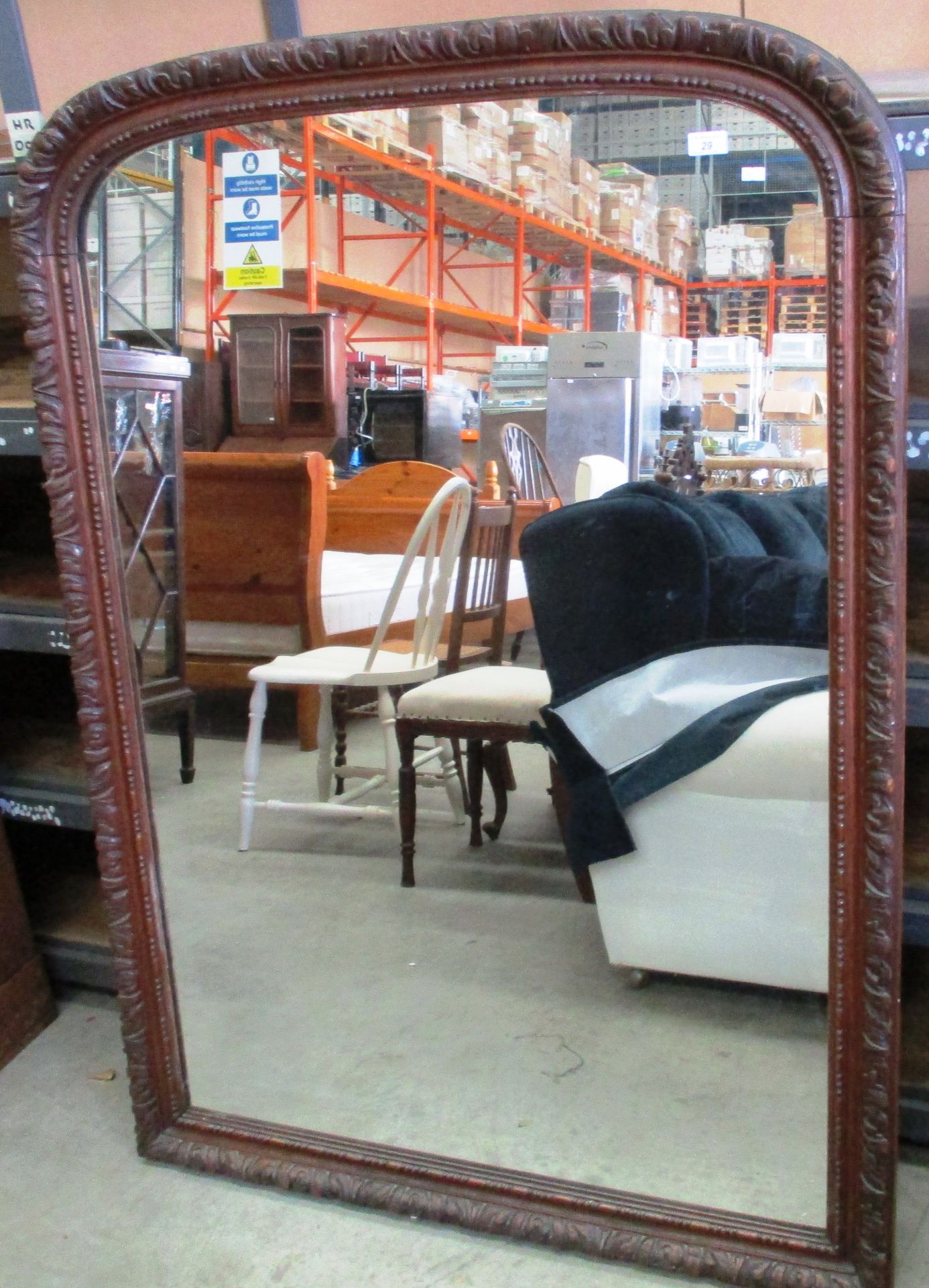 A large carved oak framed mirror 146 x 105cm