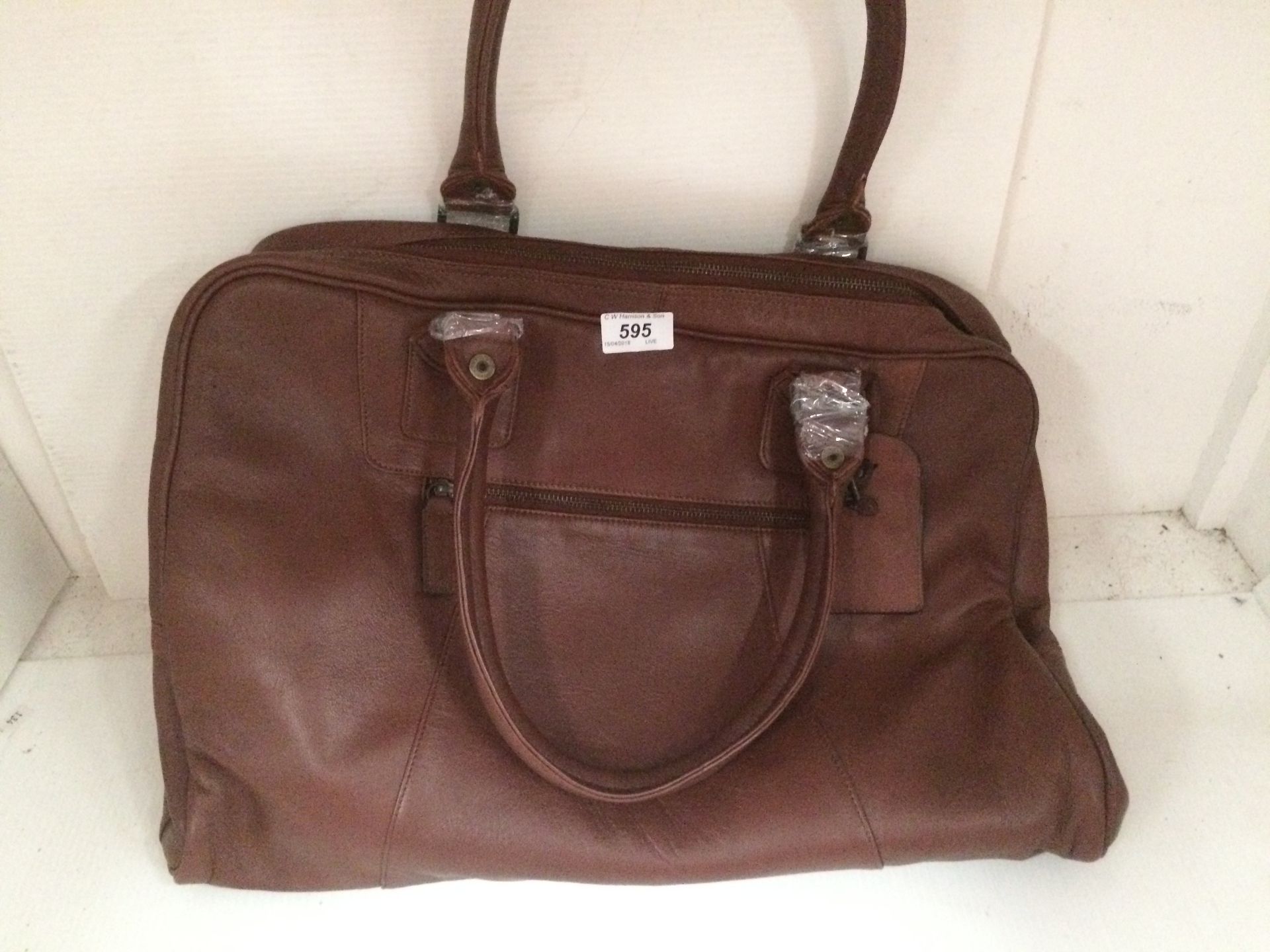 A dark brown leather handbag