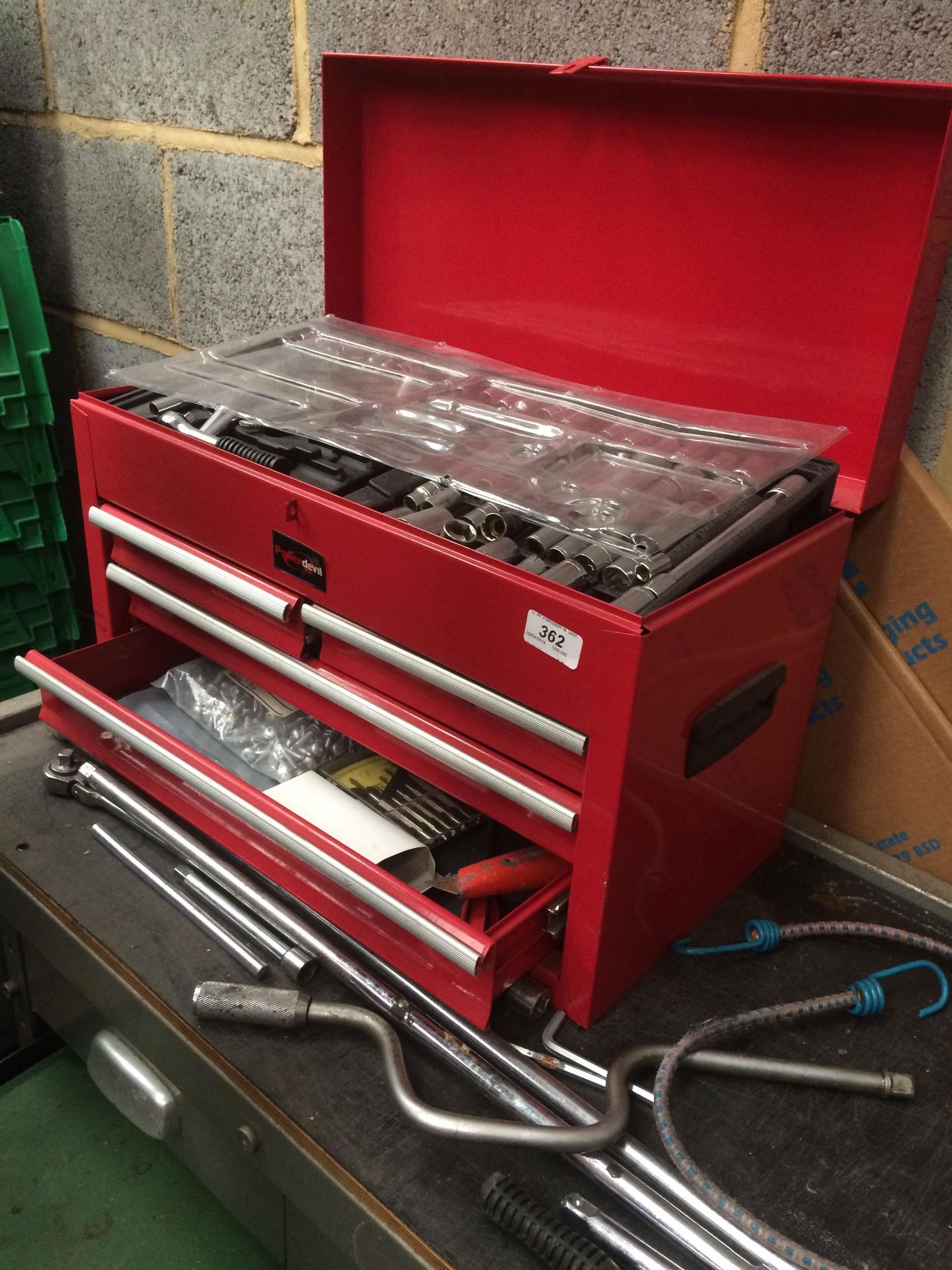 A Power Devil red metal tool box with contents - socket set, spanners, screwdrivers,