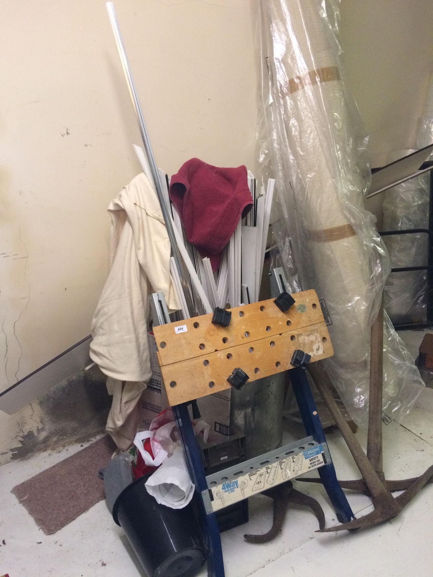 A Richmond wood working bench, pick axes, plastic trims,