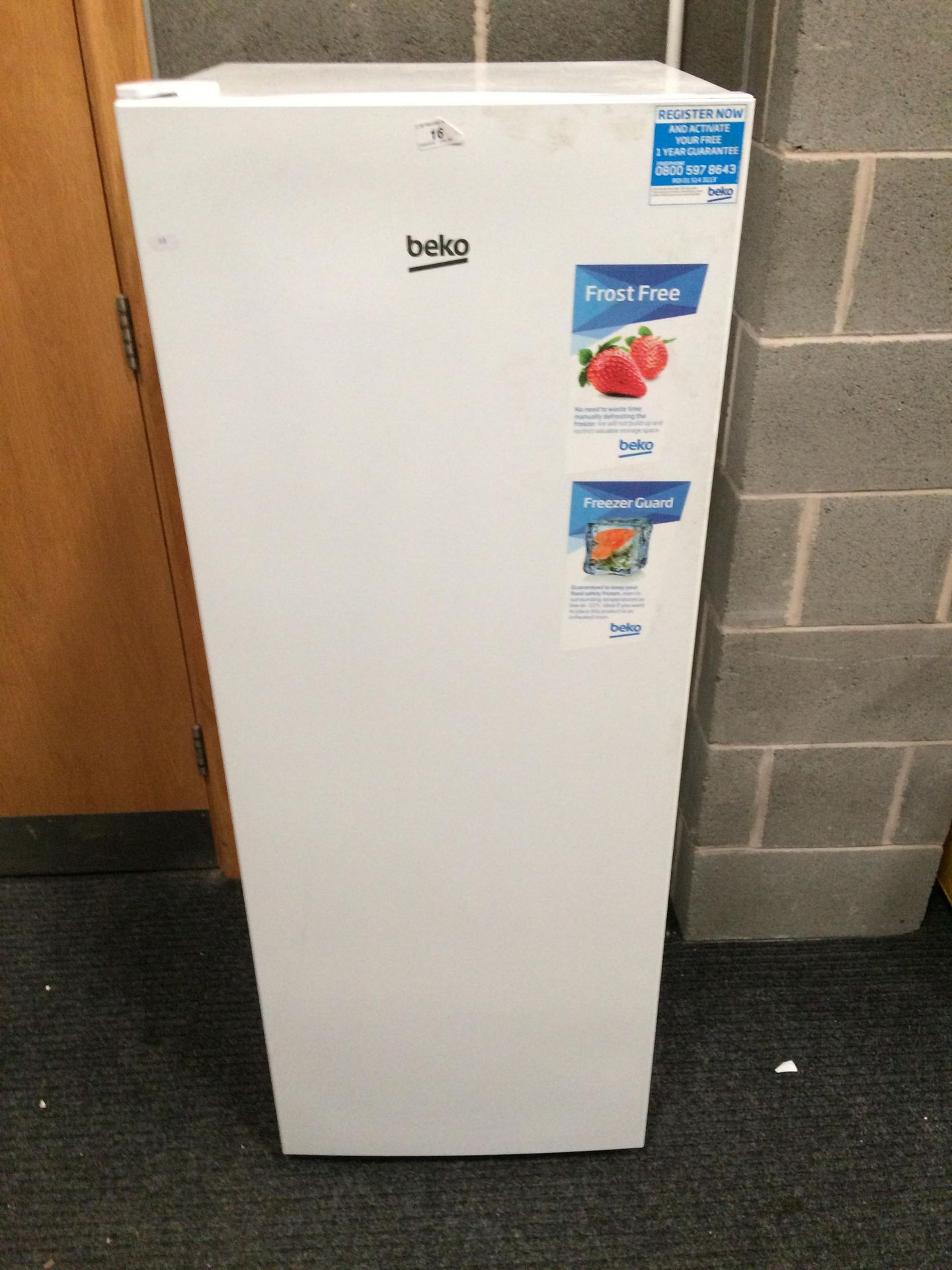 A Beko FFG1545W upright freezer