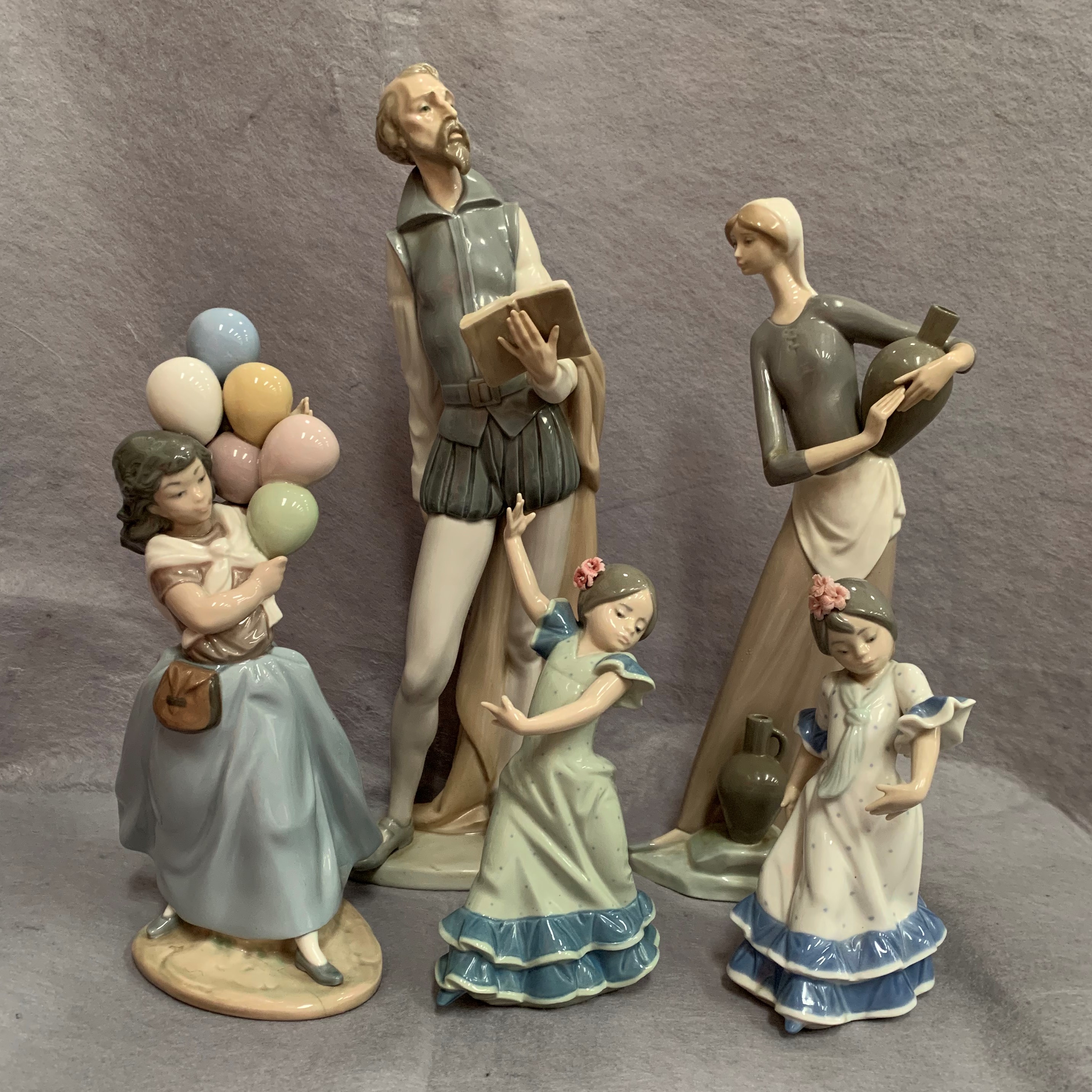 Four Lladro and one Nao figure - balloon carrier, two dancing children,