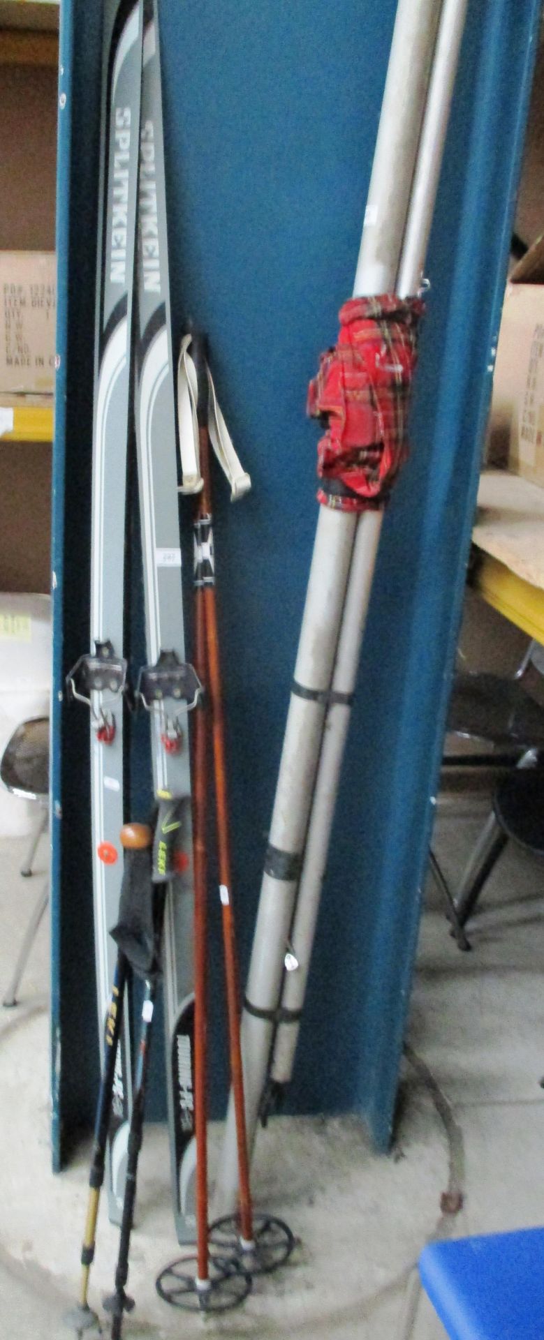 A pair of Split Kein snow skis and two pairs ski/snow walking poles