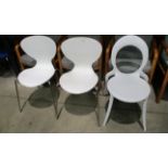 A pair of Italian white polypropylene chairs on chrome legs MRP £85 each and an Italian Design