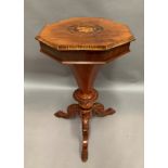 A walnut octagonal top work table with inlaid top on a tripod base - 70cm high