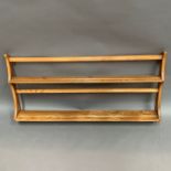 An Ercol blonde elm wall rack 100 x 50cm