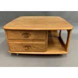 An Ercol blonde elm two drawer low square coffee table 80 x 80 cm