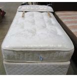 An ivory patterned 3' single bed and mattress with matching headboard