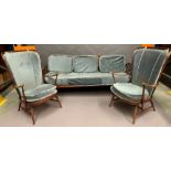 An Ercol Renaissance sofa bed settee with two matching chairs.