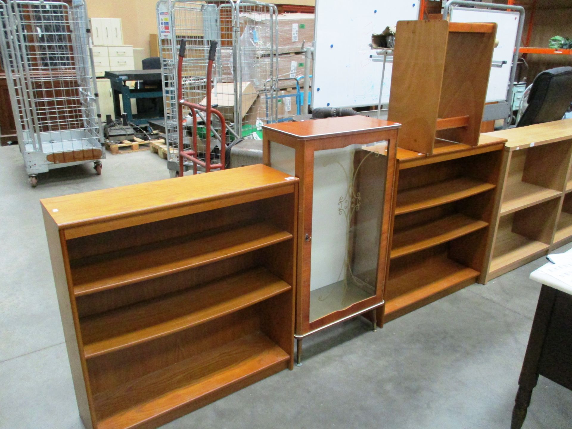 A pair of teak open front three shelf bookcases each 90 x 93cm high,