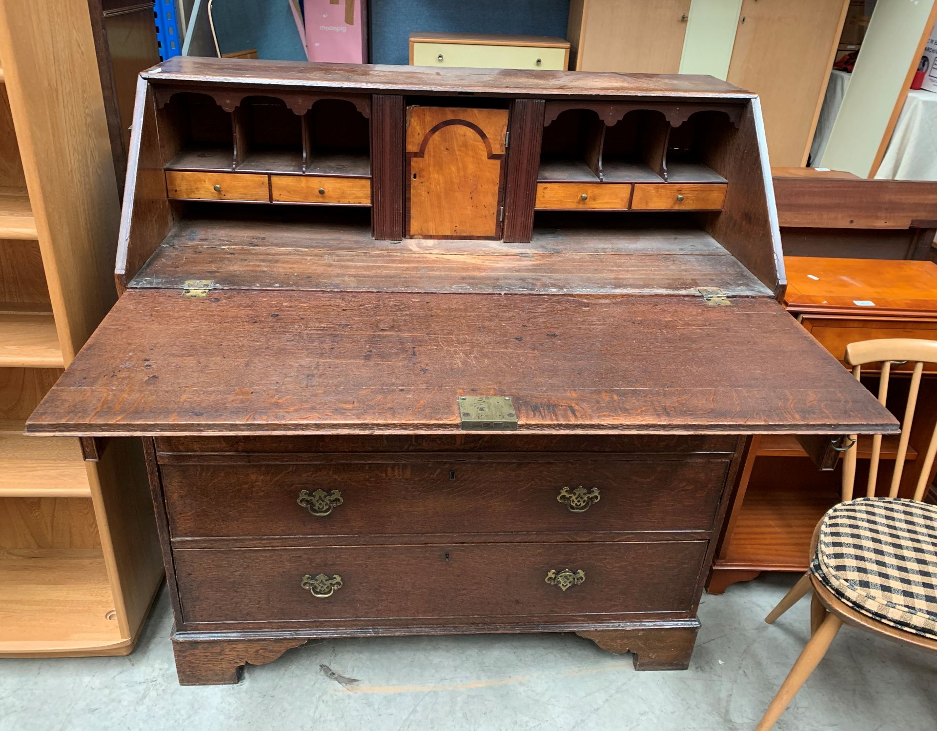 An oak drop leaf bureau with fitted interior over two short and three long drawer base, - Image 2 of 2