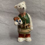 Royal Crown Derby paperweight modelled as a Teddy carrying flowers,