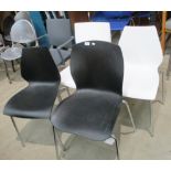 Five various polypropylene stacking chairs/armchairs in black,