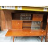 A Nathan teak wall unit with two doors and glass sliding doors 120 x 90cm high and a teak coffee