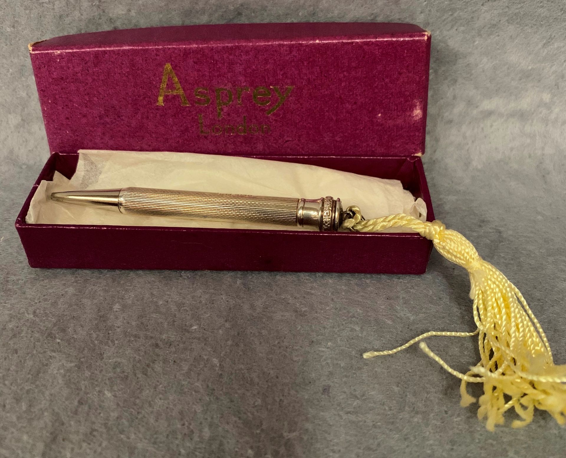 A silver propelling pencil engraved 'G.R.Applause-1972' B.