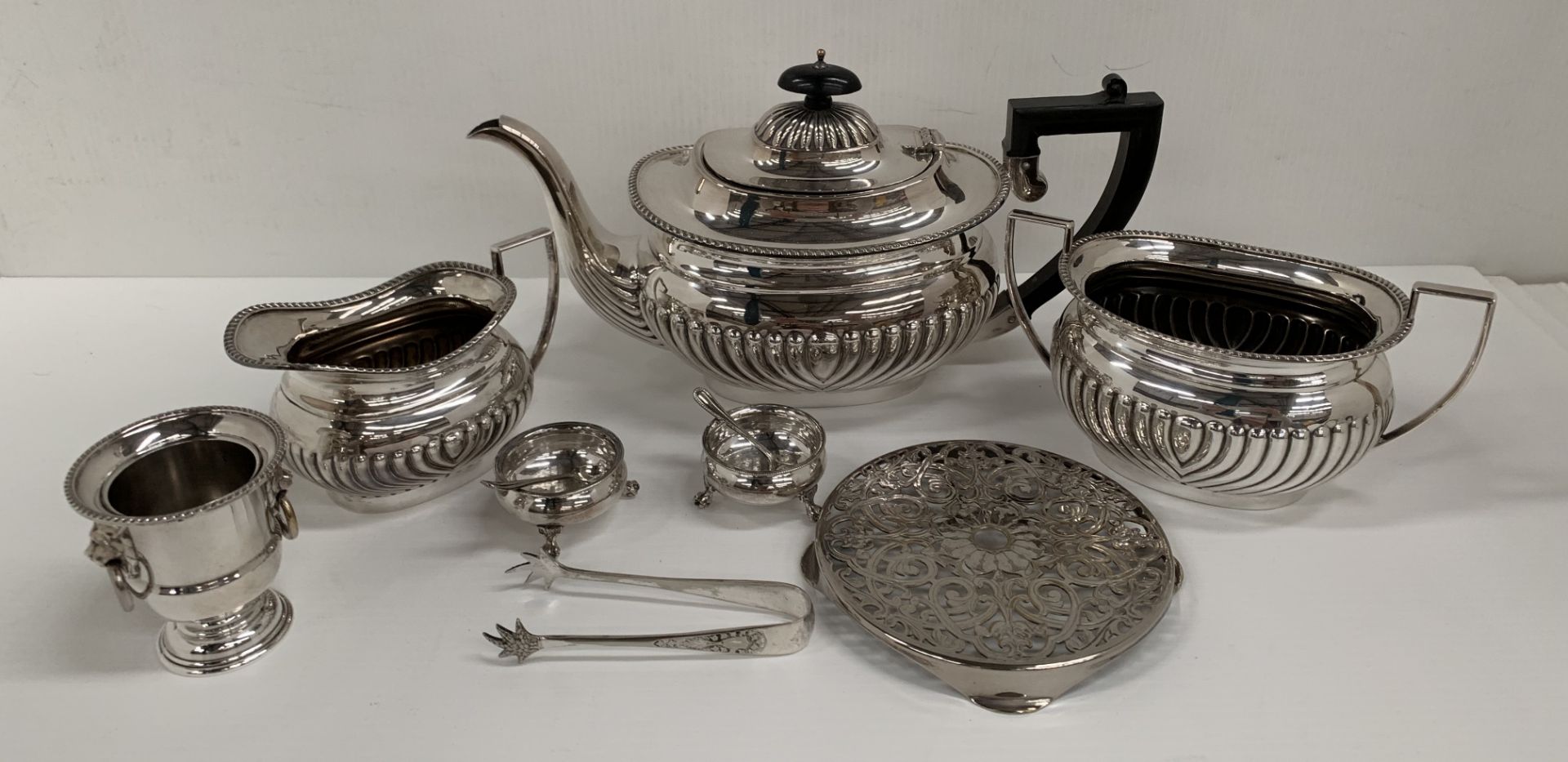 A plated three piece tea service, a plated stand, two plated salts and spoons, - Image 2 of 2