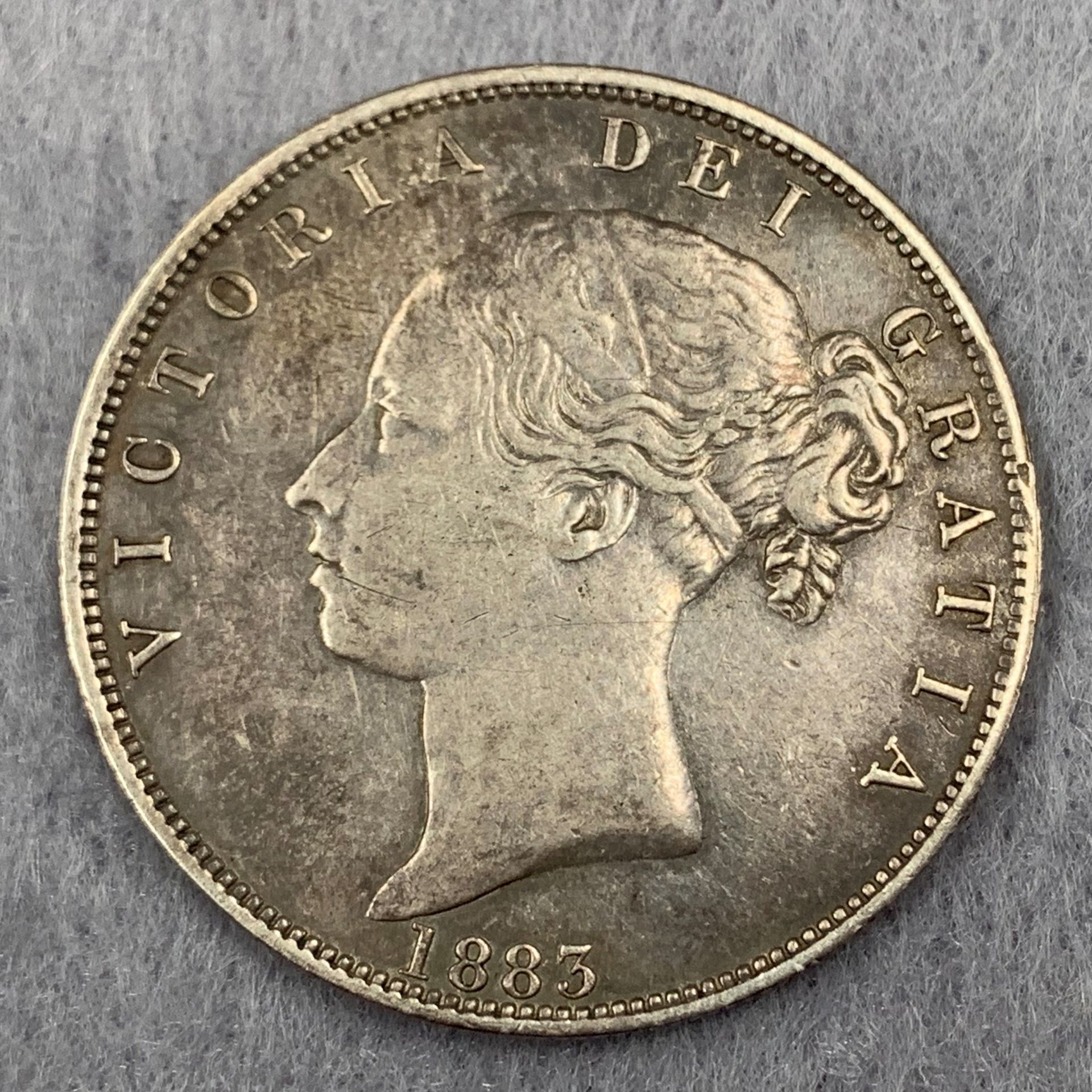 An 1883 Young Head Victoria silver half crown
