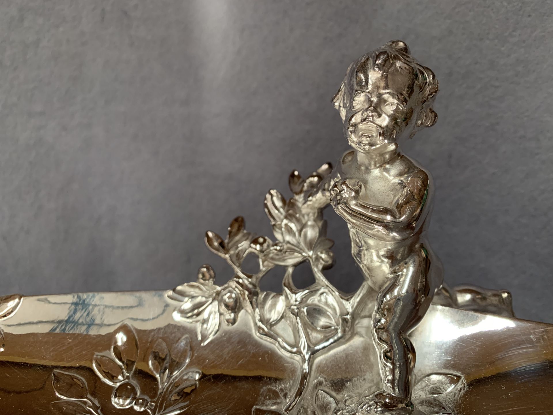 A Continental plated prize centrepiece of oval organic form embellished with putti, - Image 2 of 6