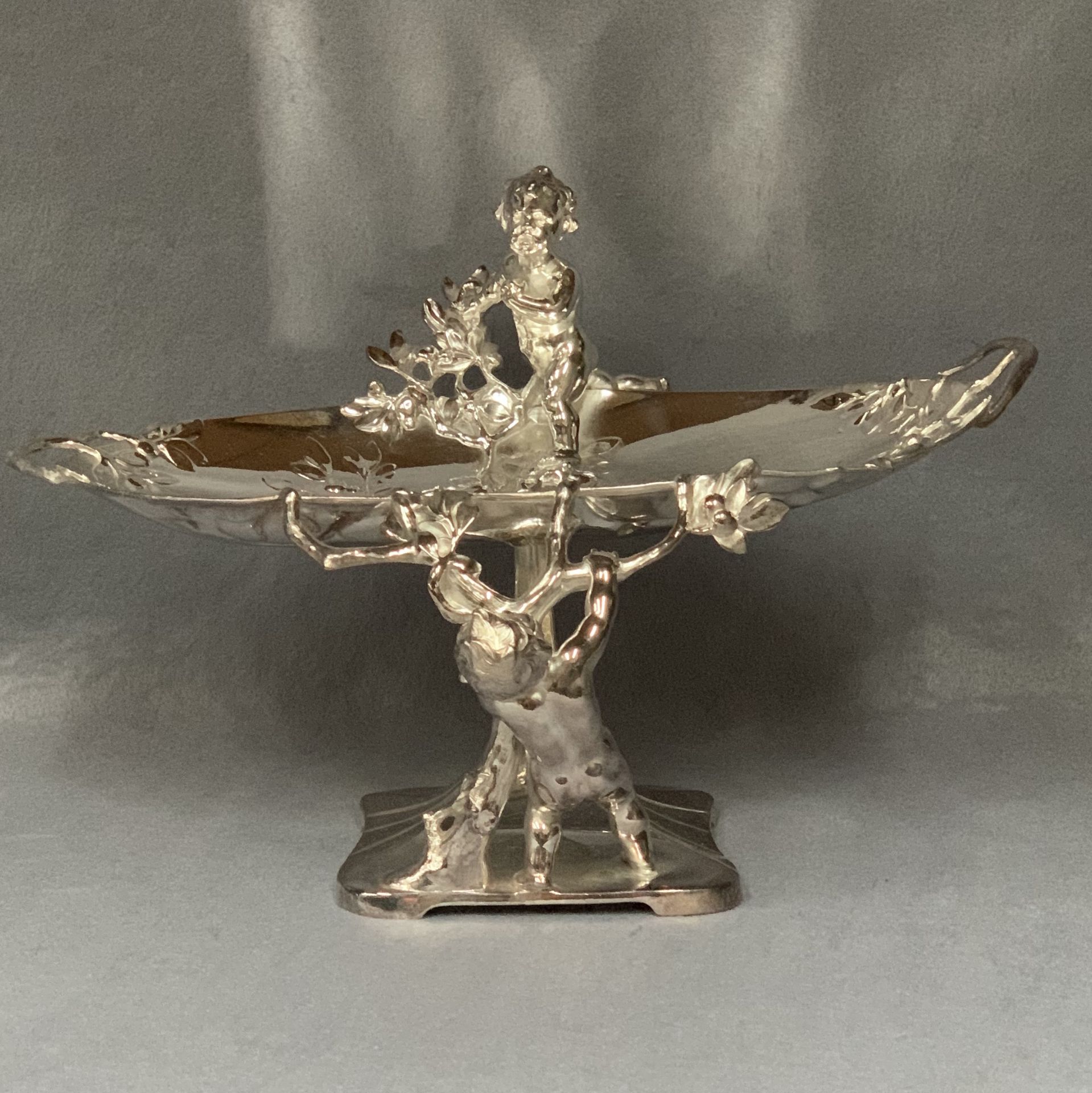 A Continental plated prize centrepiece of oval organic form embellished with putti, - Image 6 of 6