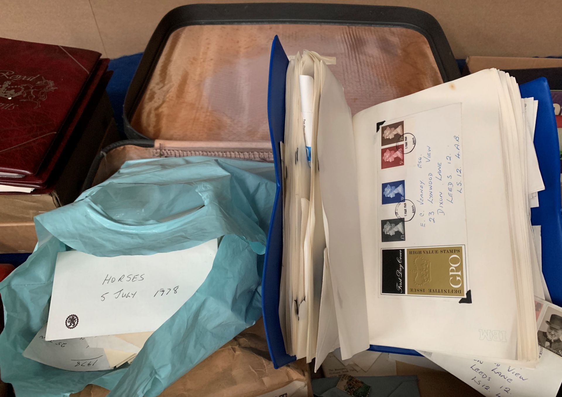 Contents to suitcase an album containing a number of Circa 1970s First Day Covers and a large