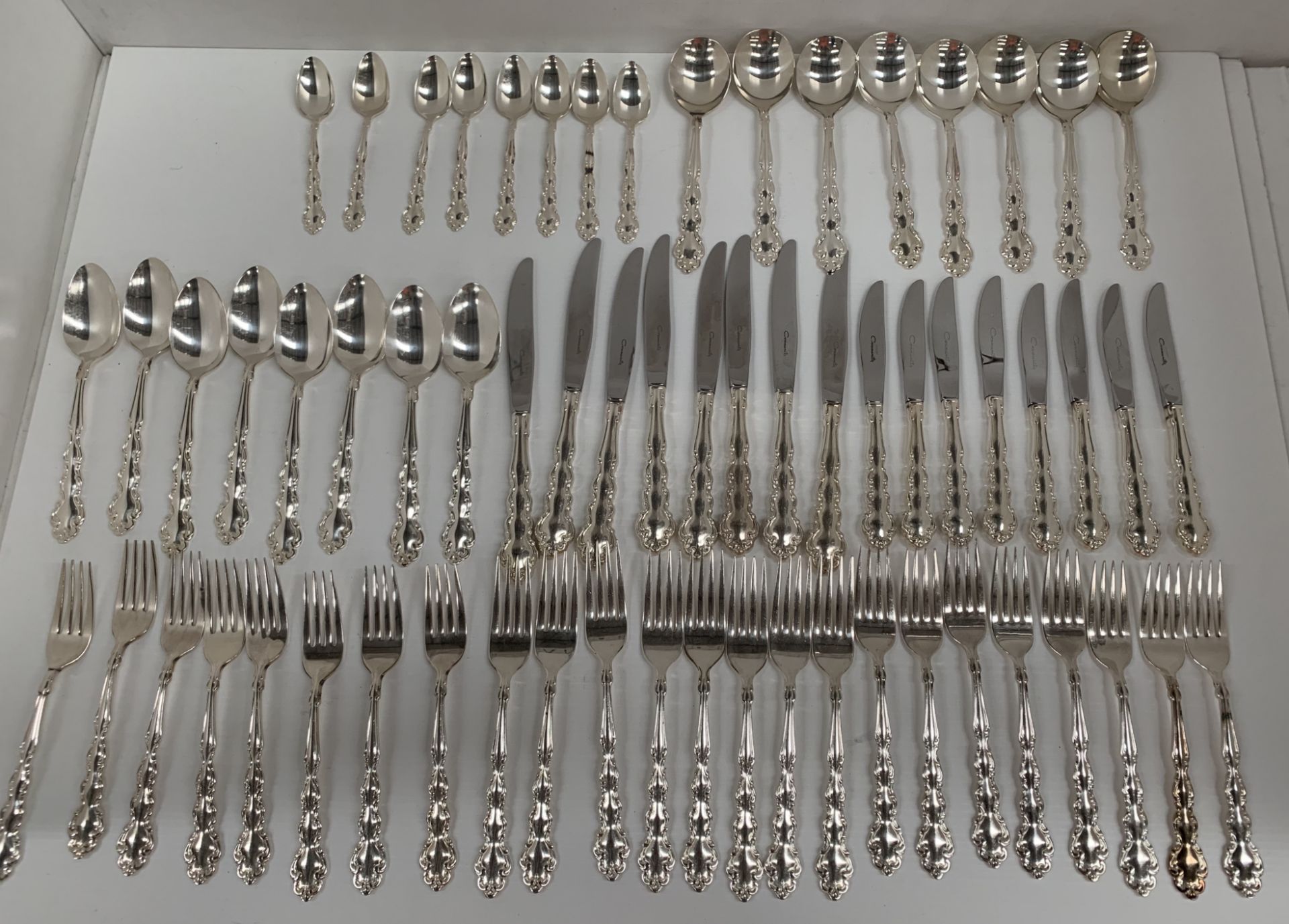 Eight place settings (64 pieces) of Mansion House Community plate cutlery