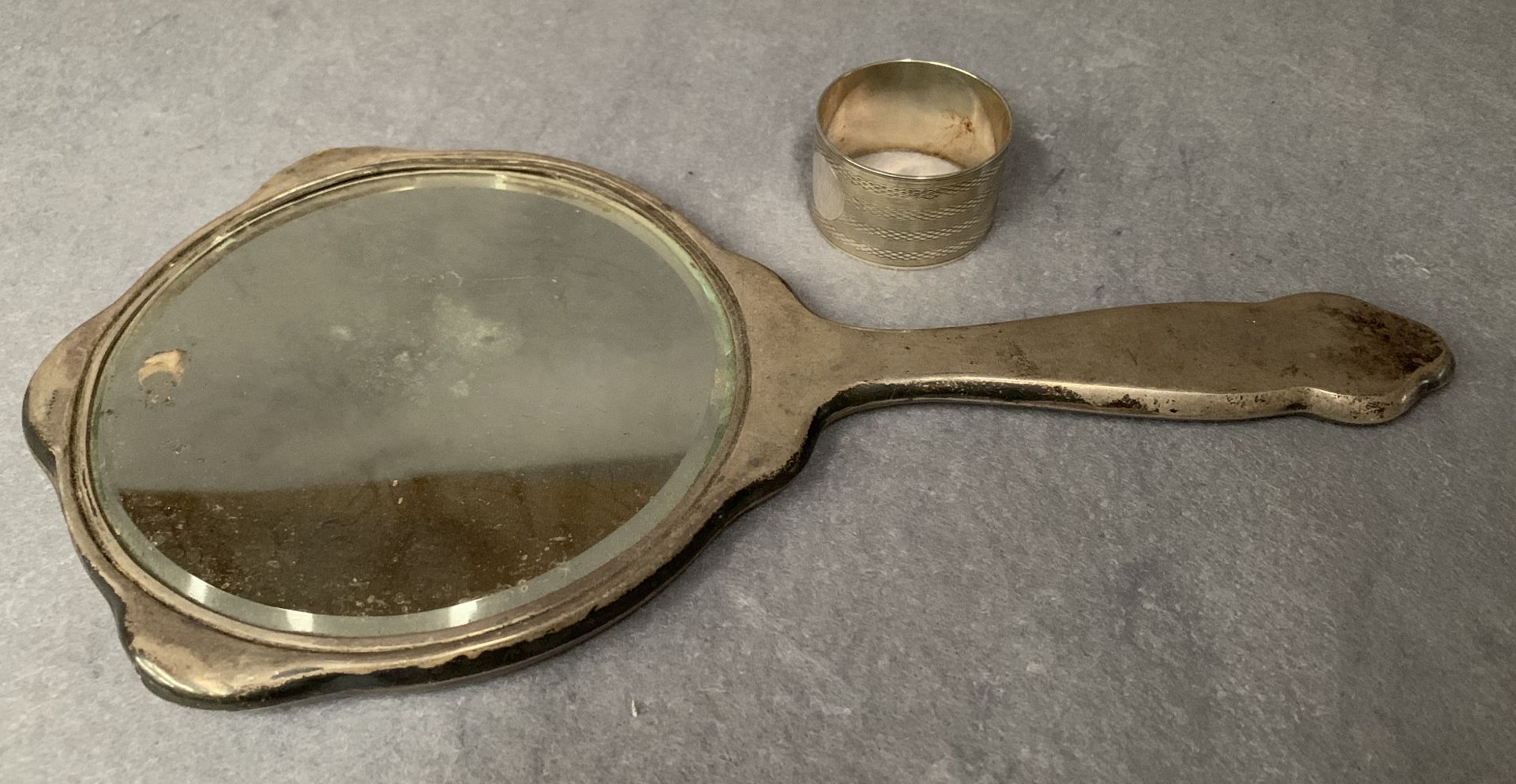 A silver mounted hand mirror, decorated with engine engraving, Birmingham 1919,