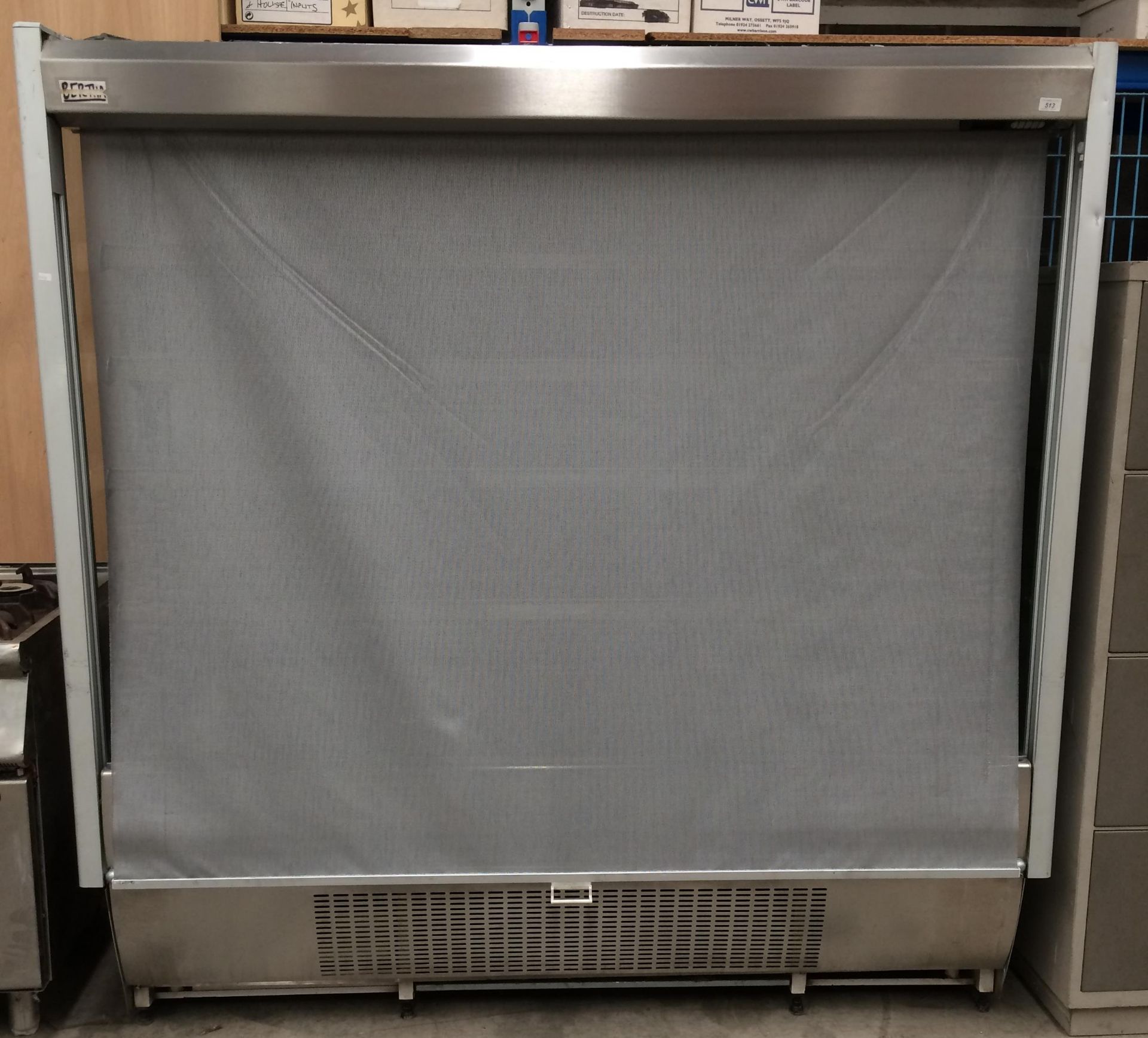 A stainless steel framed 5 shelf chilled display unit with gauze roller front 195 x 56 x 193cm high