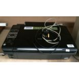 An Epson Stylus DX8450 printer/scanner with power lead