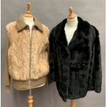 Fur trimmed bomber style ladies jacket and a black fur jacket