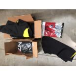 Contents to two boxes - packs of Pro II orthotic insoles, childrens wet suit tops,