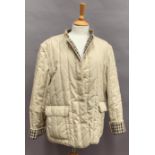 Ladies padded jacket with detachable sleeves by Aquascutum