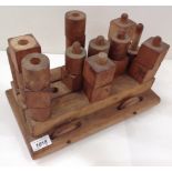 A wooden pull-a-long toy with a quantity of wooden building blocks