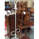 An oak hat and coat stand and a white painted metal hat and coat stand (2) Further