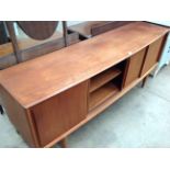 An H.P.Hansen, Denmark, teak curved front four door long John sideboard 200cm