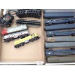 Contents to two trays - Tri-ang track, power unit, two locomotives,
