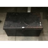 A black metal travel trunk