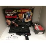 A Sinclair ZX Spectrum +2 James Bond 007 action pack game computer, complete with handgun,