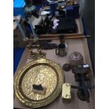 Contents to two trays - pair of brass candle sticks, large brass plate, brass mantel clock,