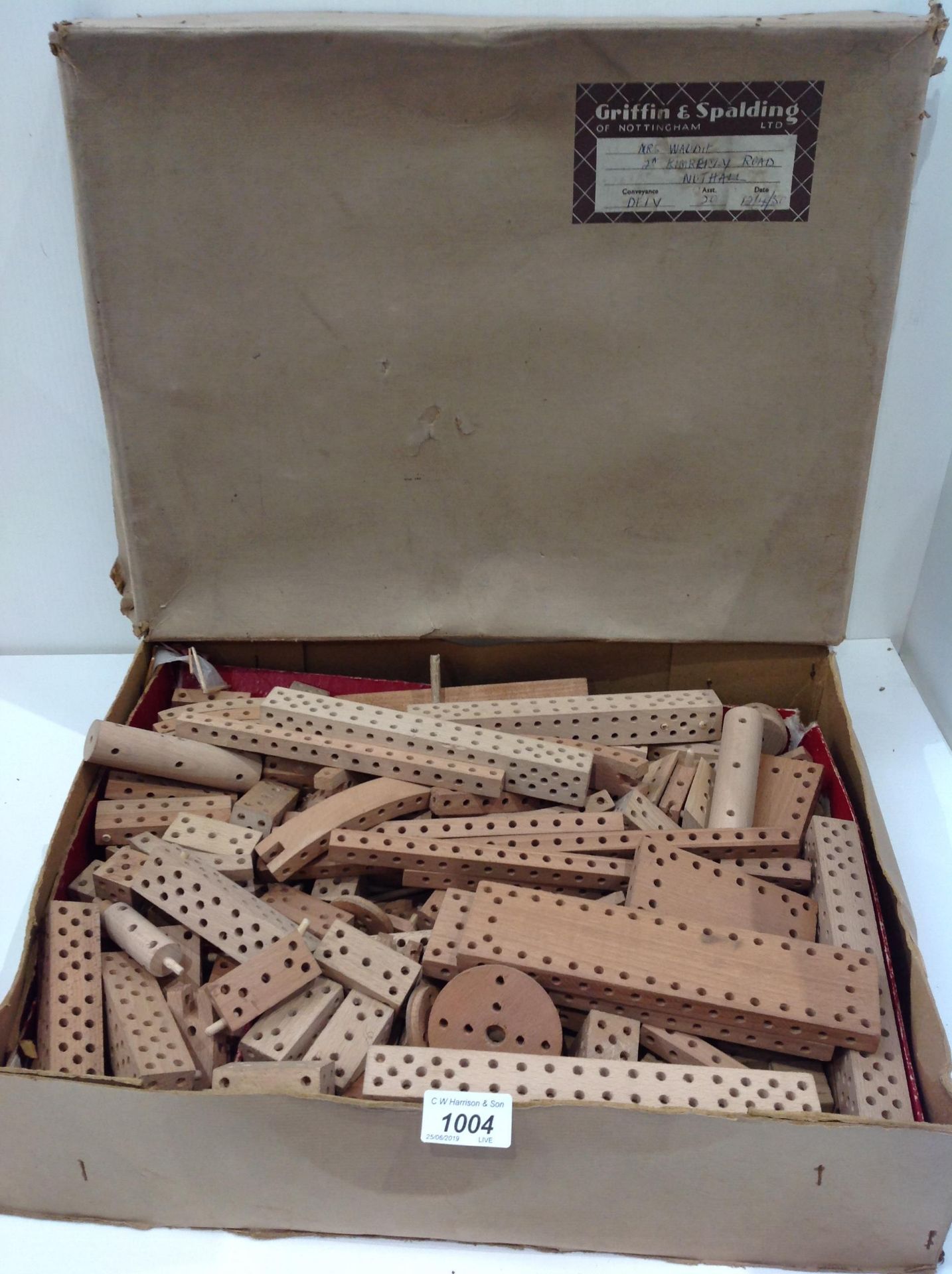 A childs wooden building peg block set in Griffin & Spalding Ltd box