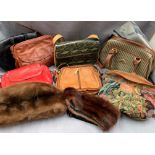 Contents to table top - quantity of assorted ladies handbags and an Antler suitcase set comprising