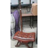 Two items - dark oak floor lamp and a dark oak foot stool with brown leather effect upholstery