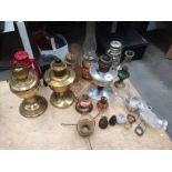 A pair of brass oil lamps and other oil lamps