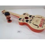 A Selcol 'Beatles' New Sound plastic guitar 58cm, made in England under licence,