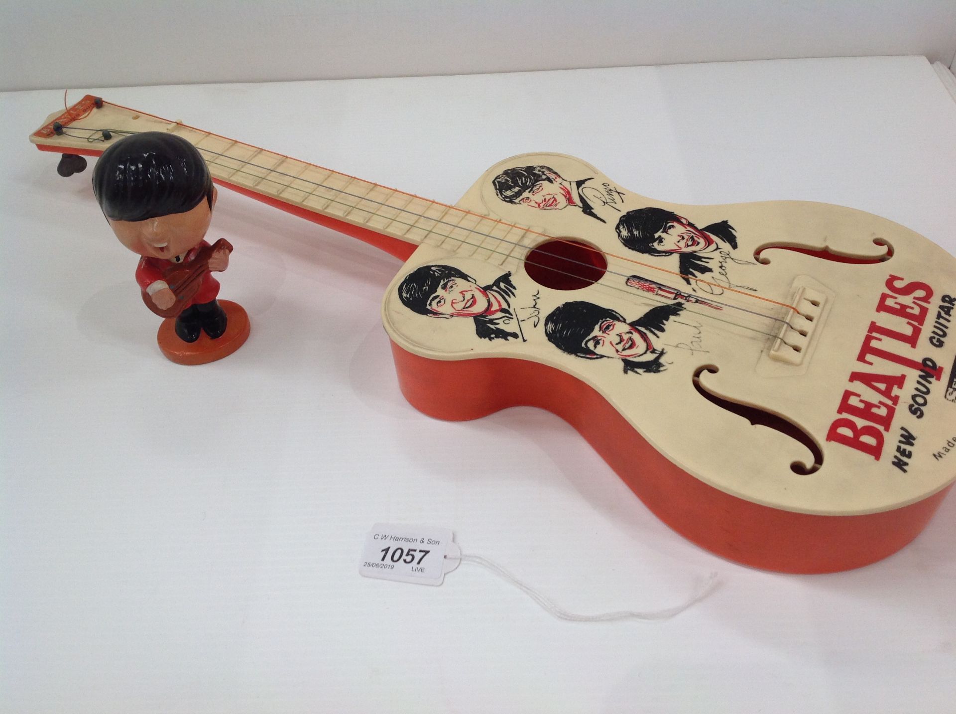 A Selcol 'Beatles' New Sound plastic guitar 58cm, made in England under licence,