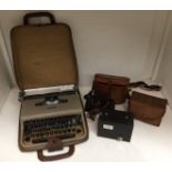 Three items - Lettera 22 typewriter in case,