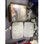 Two PlayStation PS One game consoles, two game pads,
