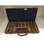 An opticians trial lens set in oak case